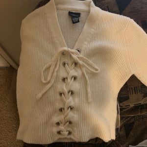 Knit front criss-cross tie sweater top
